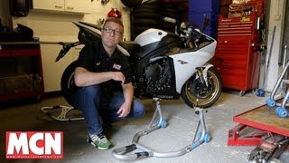 How to Use a paddock stand  Products  Motorcyclenewscom [upl. by Alyam615]